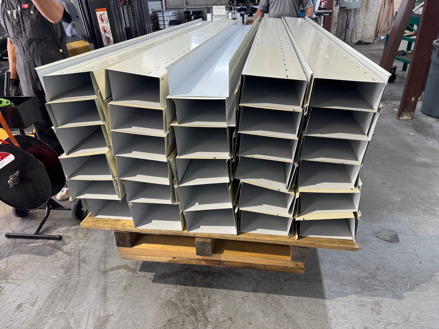 Fabricated sheet-metal flashing and trim detail showing the kind of in-shop coping, cleat and corner work Superb Metals produces
